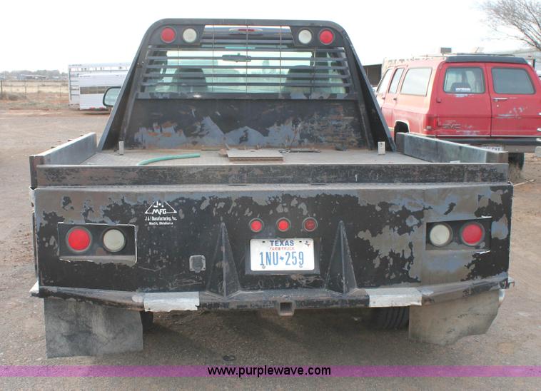 image for item H1604 2004 Ford F350 Super Duty flatbed truck