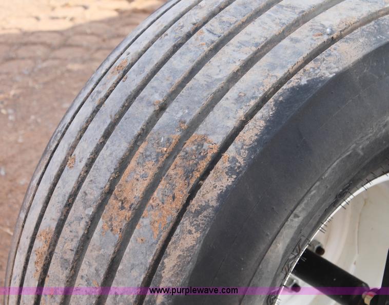 image for item H1608 2013 MacDon M205 self-propelled windrower