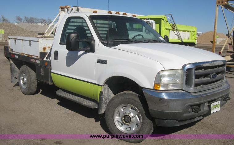image for item K2861 2002 Ford F250 Super Duty XLT flatbed pickup truck