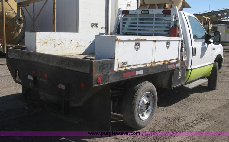 image for item K2861 2002 Ford F250 Super Duty XLT flatbed pickup truck