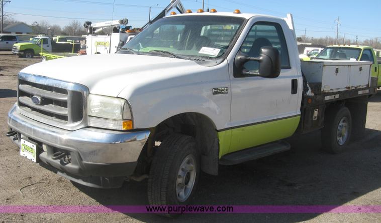 image for item K2861 2002 Ford F250 Super Duty XLT flatbed pickup truck