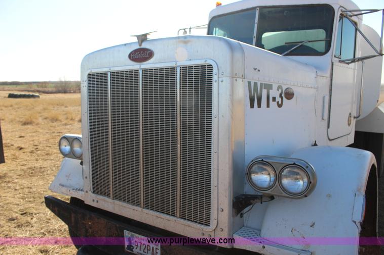 image for item L6674 1986 Peterbilt 359 water truck