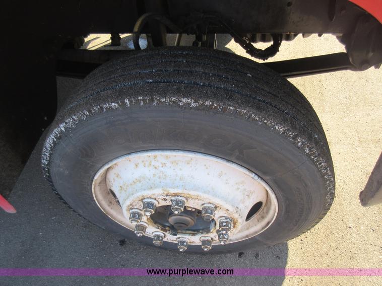 image for item J1992 1998 Freightliner FL70 flatbed truck