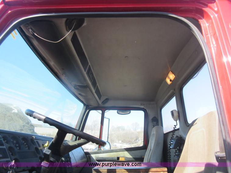 image for item J1992 1998 Freightliner FL70 flatbed truck