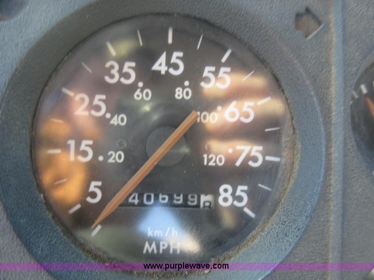 image for item J1992 1998 Freightliner FL70 flatbed truck