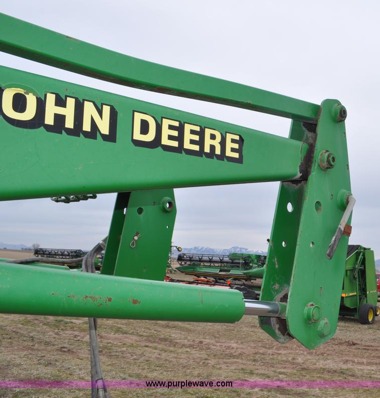image for item F2283 John Deere 840 tractor loader