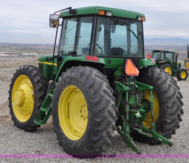 image for item F2292 2000 John Deere 7510 MFWD tractor