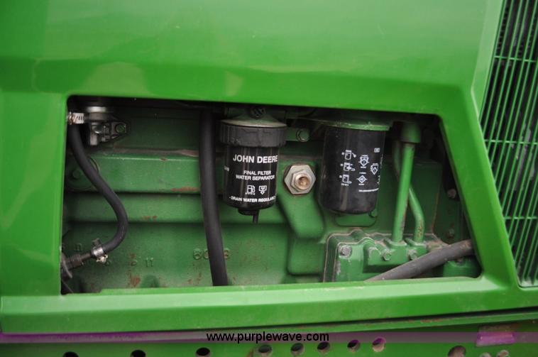 image for item F2292 2000 John Deere 7510 MFWD tractor