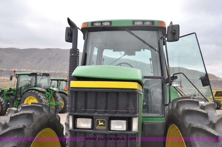 image for item F2292 2000 John Deere 7510 MFWD tractor