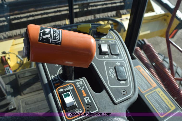 image for item K2432 2003 New Holland HW320 self-propelled windrower