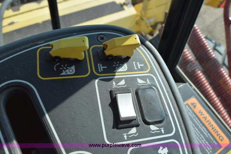 image for item K2432 2003 New Holland HW320 self-propelled windrower