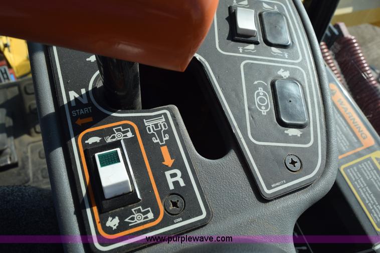 image for item K2432 2003 New Holland HW320 self-propelled windrower