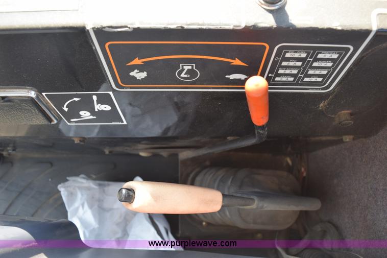 image for item K2432 2003 New Holland HW320 self-propelled windrower