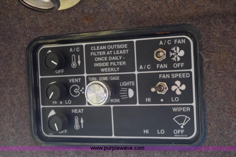 image for item K2432 2003 New Holland HW320 self-propelled windrower