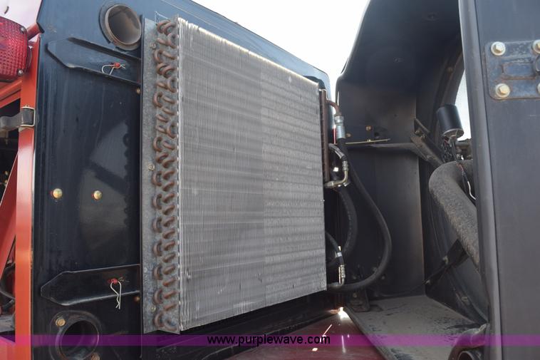 image for item K2432 2003 New Holland HW320 self-propelled windrower