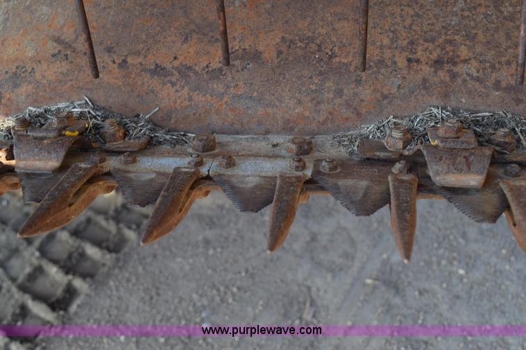 image for item K2432 2003 New Holland HW320 self-propelled windrower