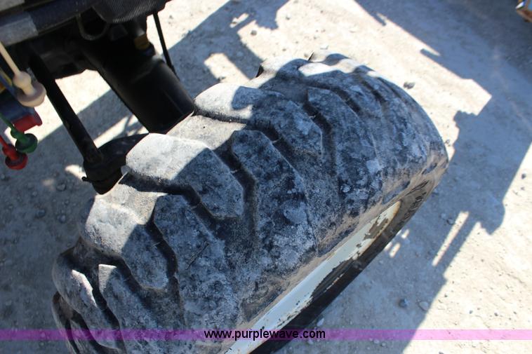 image for item L6737 2005 New Holland TC33DA MFWD compact utility tractor