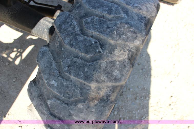 image for item L6737 2005 New Holland TC33DA MFWD compact utility tractor