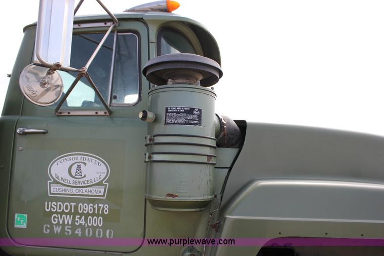 image for item J2270 2000 Mack RD690S rotating drum mixer truck