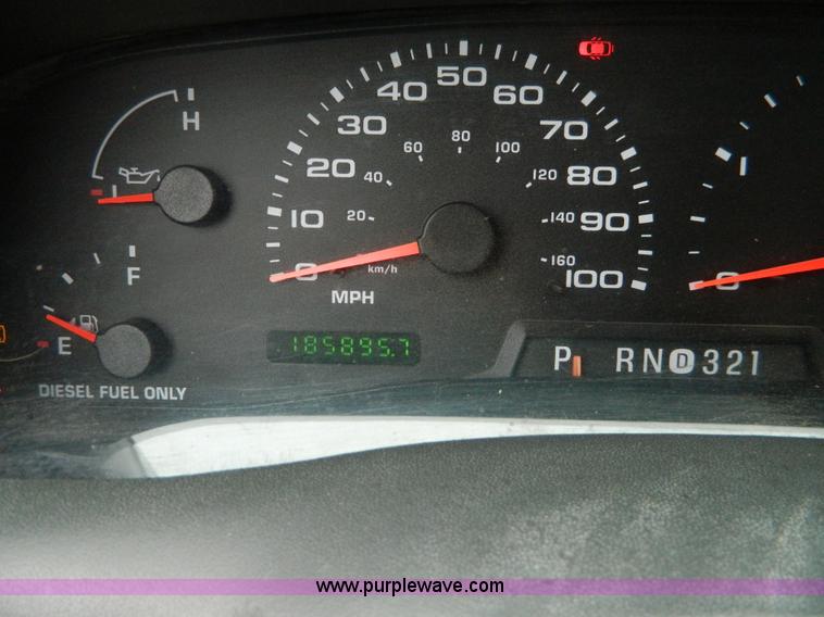 image for item D6119 2004 Ford F250 Super Duty SuperCab flatbed pickup truck