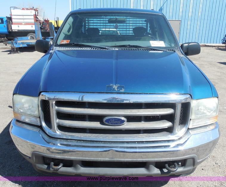 image for item E6311 2002 Ford F250 Super Duty SuperCab flatbed pickup truck