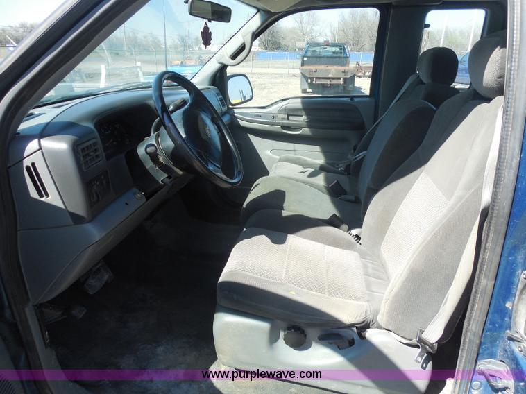 image for item E6311 2002 Ford F250 Super Duty SuperCab flatbed pickup truck