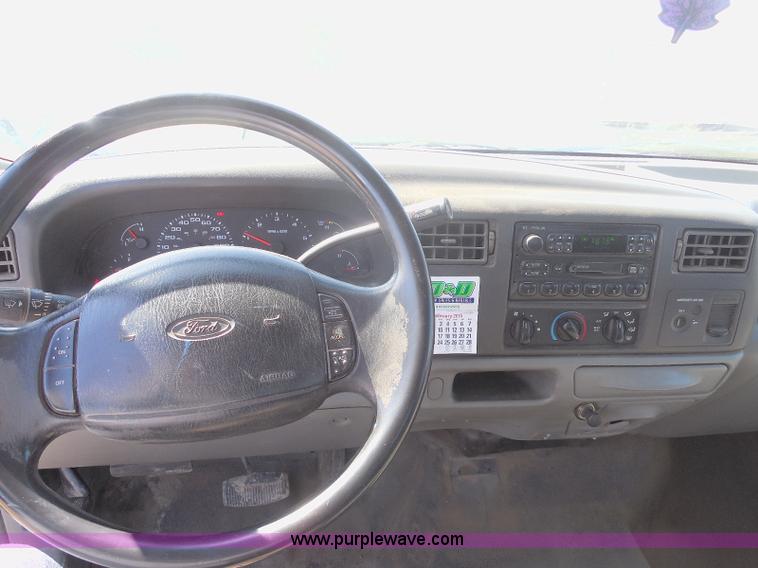 image for item E6311 2002 Ford F250 Super Duty SuperCab flatbed pickup truck