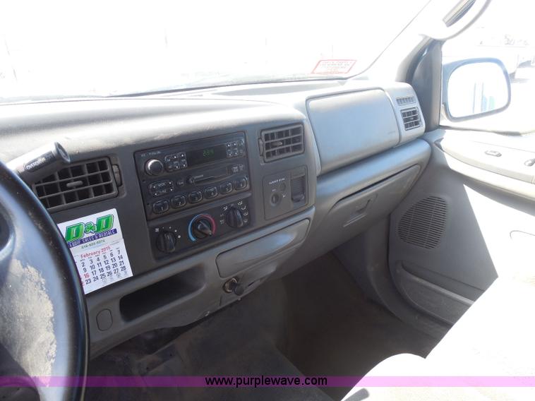 image for item E6311 2002 Ford F250 Super Duty SuperCab flatbed pickup truck