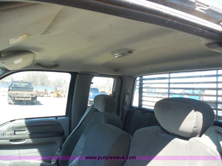 image for item E6311 2002 Ford F250 Super Duty SuperCab flatbed pickup truck