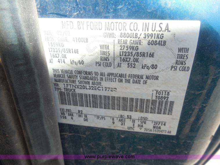 image for item E6311 2002 Ford F250 Super Duty SuperCab flatbed pickup truck