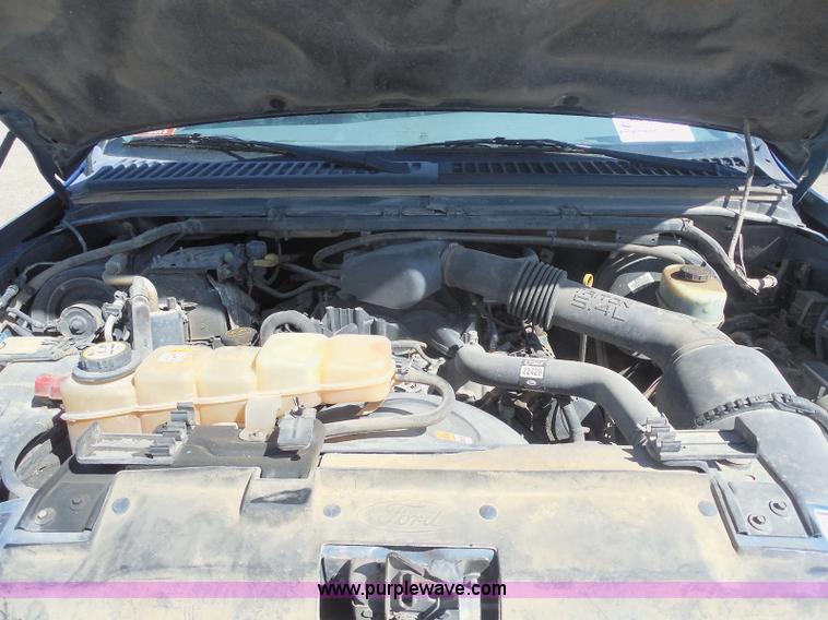 image for item E6311 2002 Ford F250 Super Duty SuperCab flatbed pickup truck