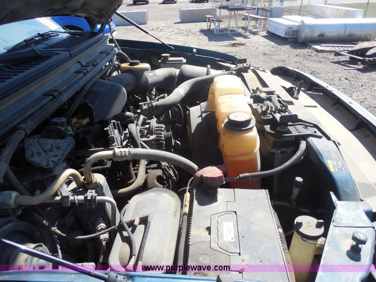 image for item E6311 2002 Ford F250 Super Duty SuperCab flatbed pickup truck