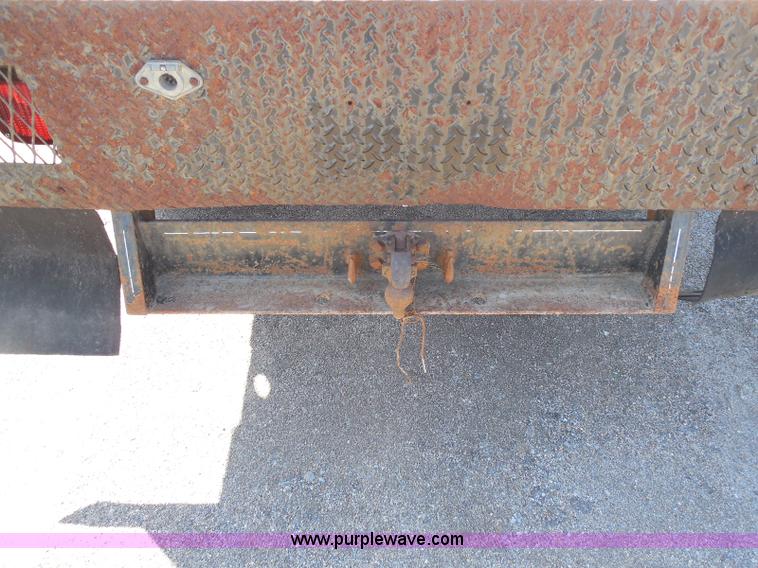 image for item E6311 2002 Ford F250 Super Duty SuperCab flatbed pickup truck