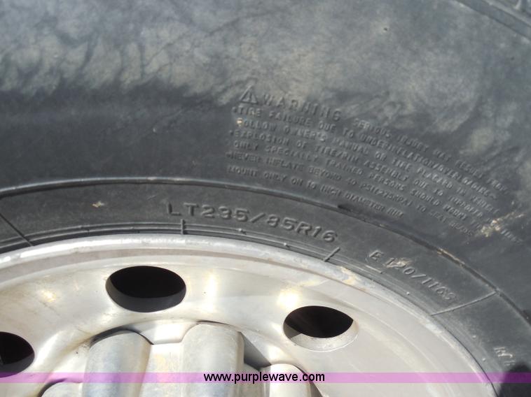 image for item E6311 2002 Ford F250 Super Duty SuperCab flatbed pickup truck