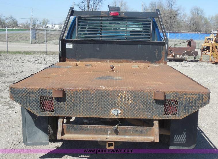 image for item E6312 2002 Ford F250 Super Duty SuperCab flatbed pickup truck
