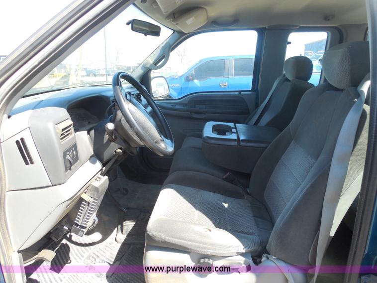 image for item E6312 2002 Ford F250 Super Duty SuperCab flatbed pickup truck