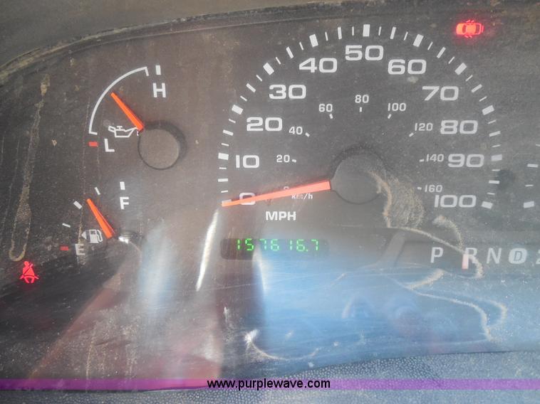 image for item E6312 2002 Ford F250 Super Duty SuperCab flatbed pickup truck