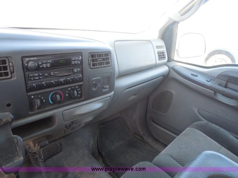 image for item E6312 2002 Ford F250 Super Duty SuperCab flatbed pickup truck