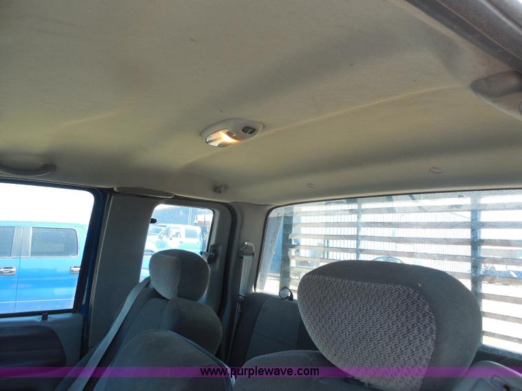 image for item E6312 2002 Ford F250 Super Duty SuperCab flatbed pickup truck