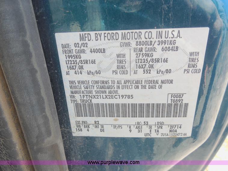 image for item E6312 2002 Ford F250 Super Duty SuperCab flatbed pickup truck