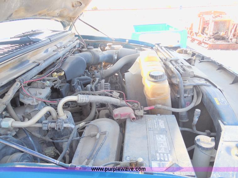 image for item E6312 2002 Ford F250 Super Duty SuperCab flatbed pickup truck