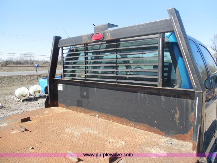 image for item E6312 2002 Ford F250 Super Duty SuperCab flatbed pickup truck