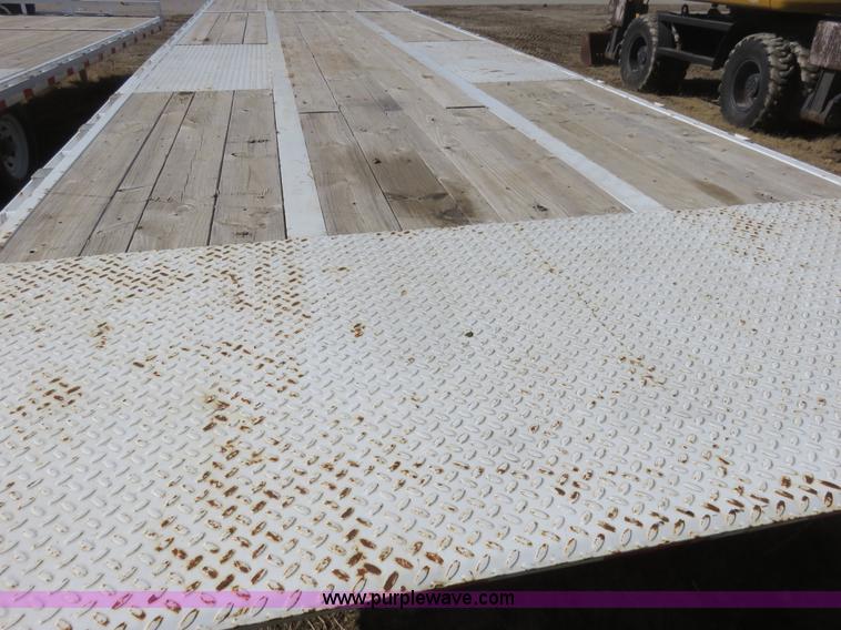 image for item K7098 2010 PJ gooseneck tilt deck trailer