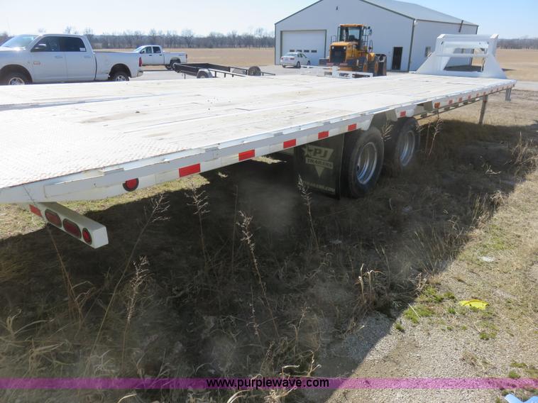 image for item K7098 2010 PJ gooseneck tilt deck trailer