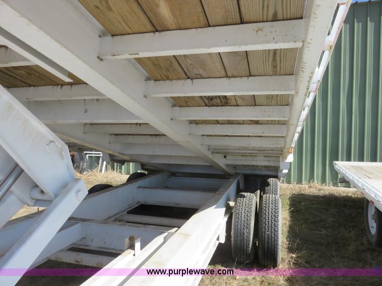 image for item K7098 2010 PJ gooseneck tilt deck trailer