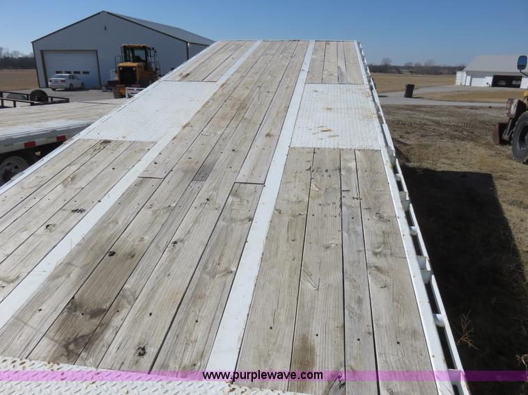 image for item K7098 2010 PJ gooseneck tilt deck trailer