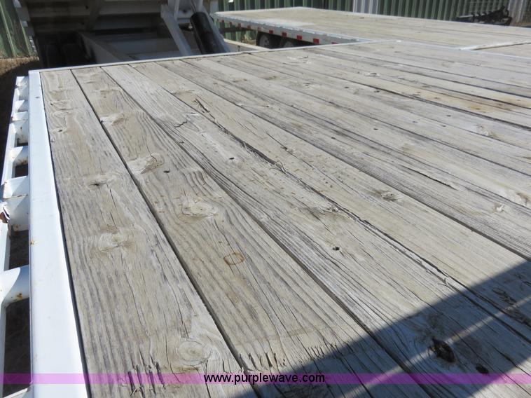 image for item K7098 2010 PJ gooseneck tilt deck trailer