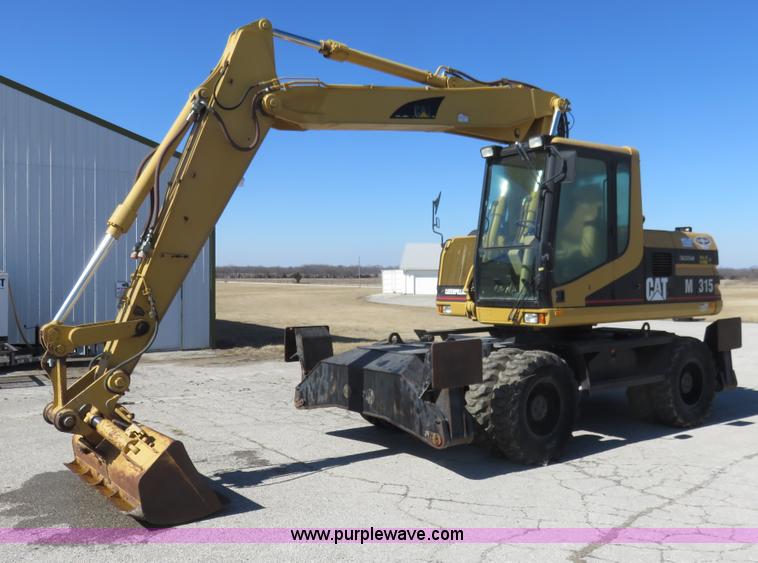 image for item K7107 2001 Caterpillar M315 rubber tire excavator