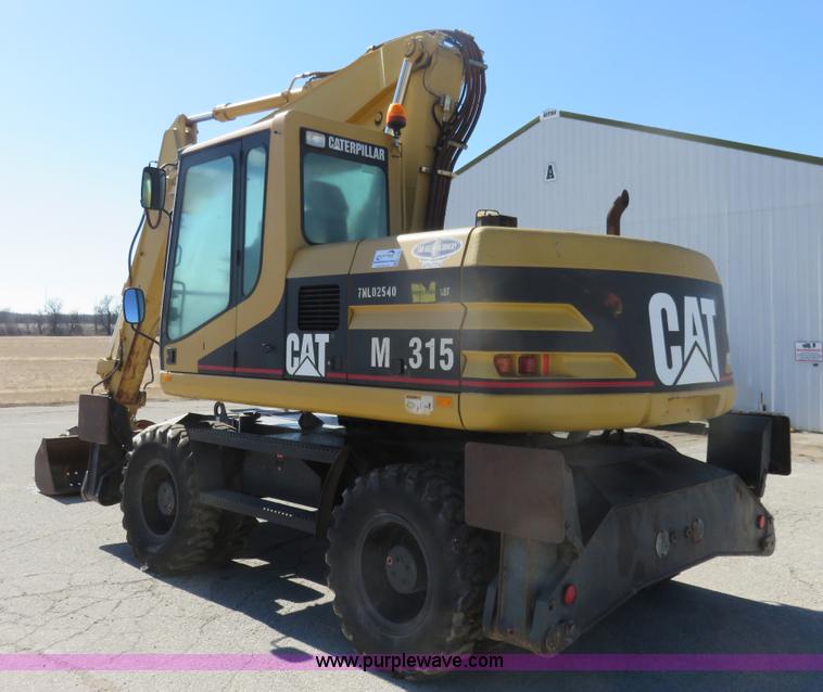 image for item K7107 2001 Caterpillar M315 rubber tire excavator