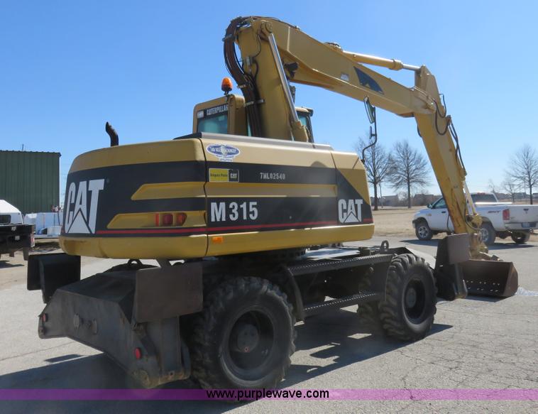 image for item K7107 2001 Caterpillar M315 rubber tire excavator